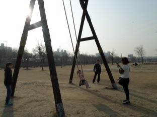 Cute family on a big swing (I know I'm a creep for taking their picture! It was just a Kodak moment!)